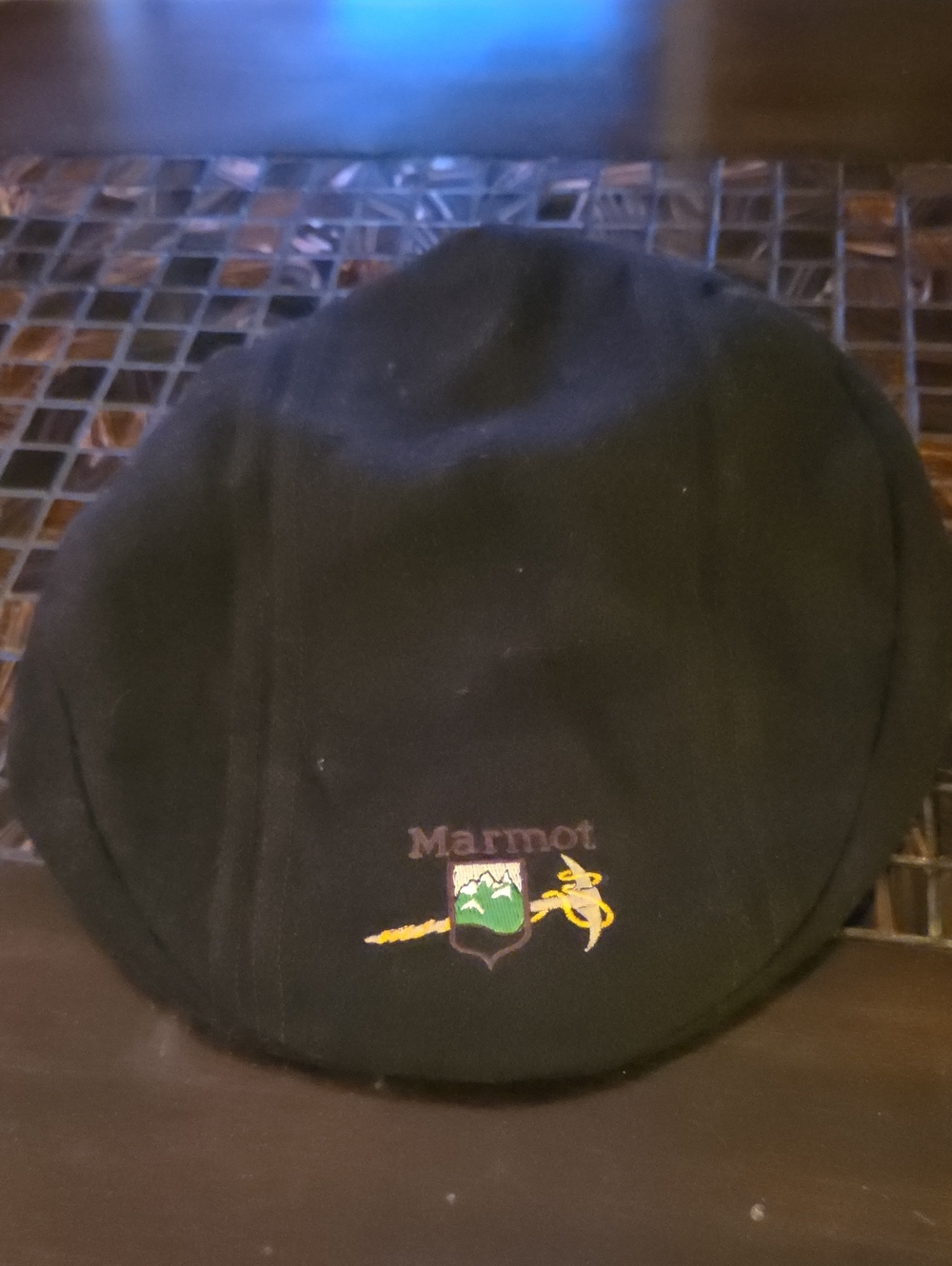Marmot Vintage Black Flat Cap with Green & Yellow Crest Embroidery